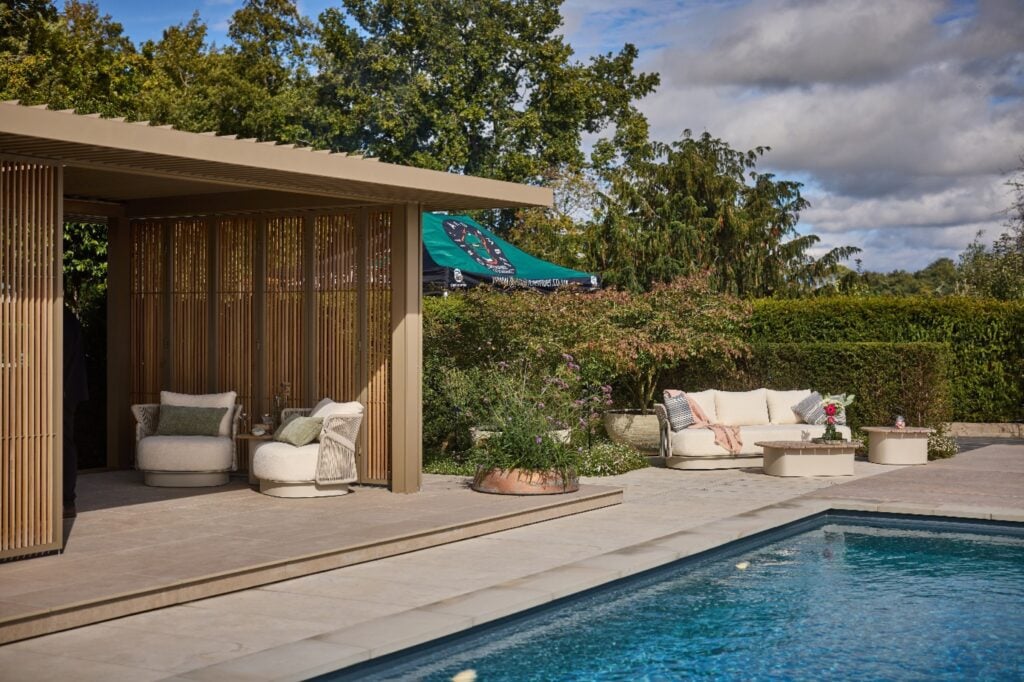 Complete luxury outdoor living space with kitchen, pergola and pool.